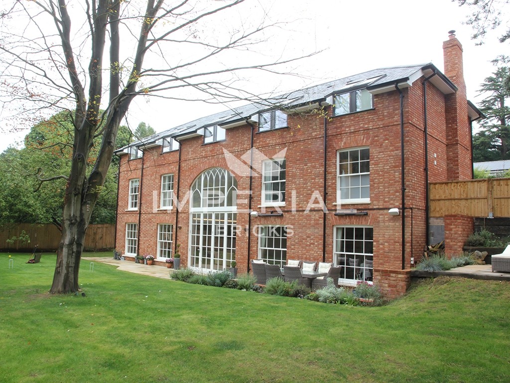 An exterior of a house built using Reclamation Soft Red bricks