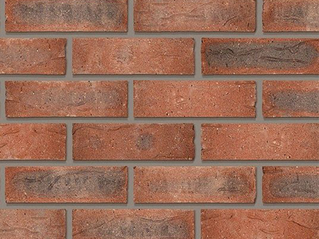 Close up of a wall of Draycott Red Multi bricks