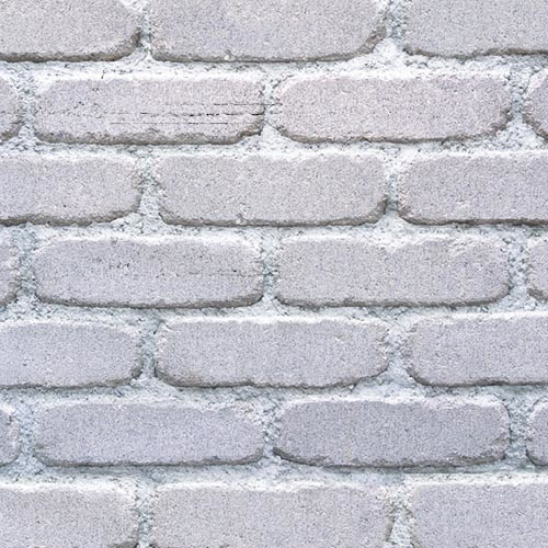 Close up of a wall of Vintage White Antique bricks
