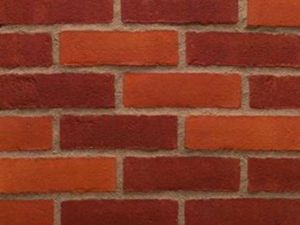 Close up of a wall of Warnham Orange Red bricks
