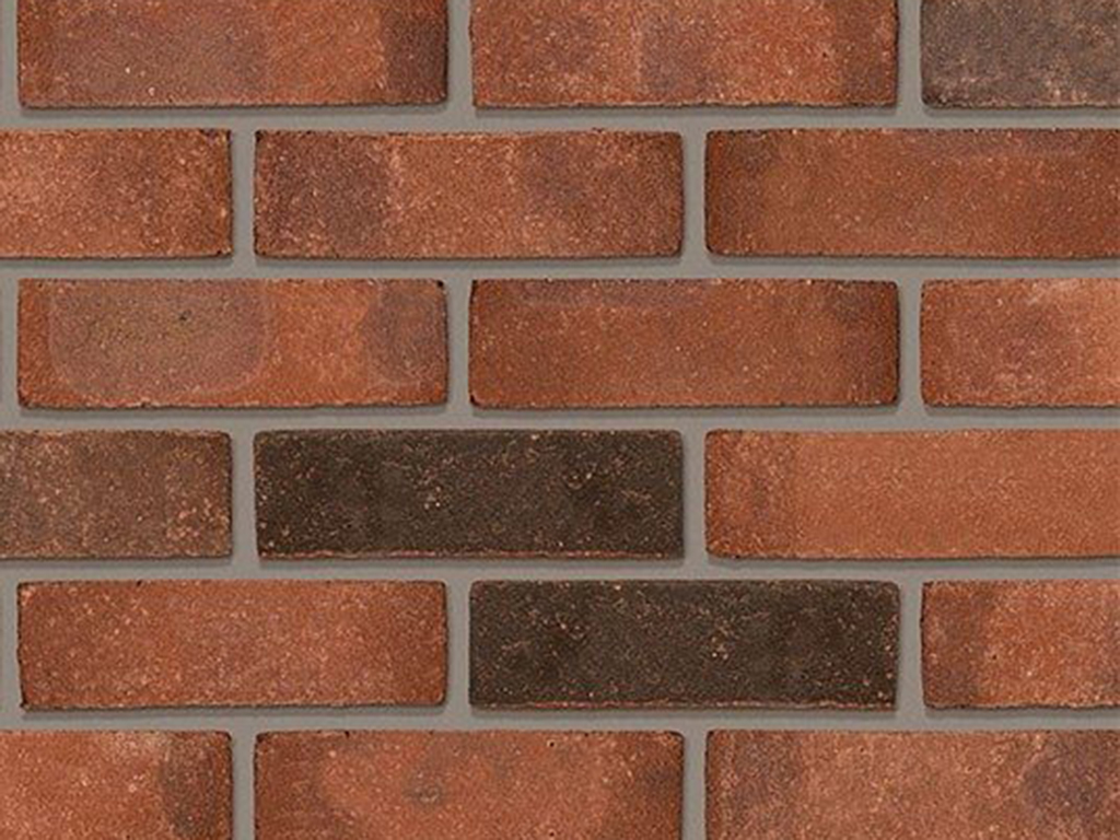 Close up of a wall of Ashington Red Multi bricks