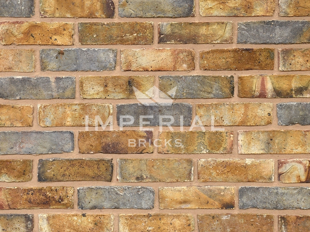 Close up of a wall of Weathered Original London Stock bricks