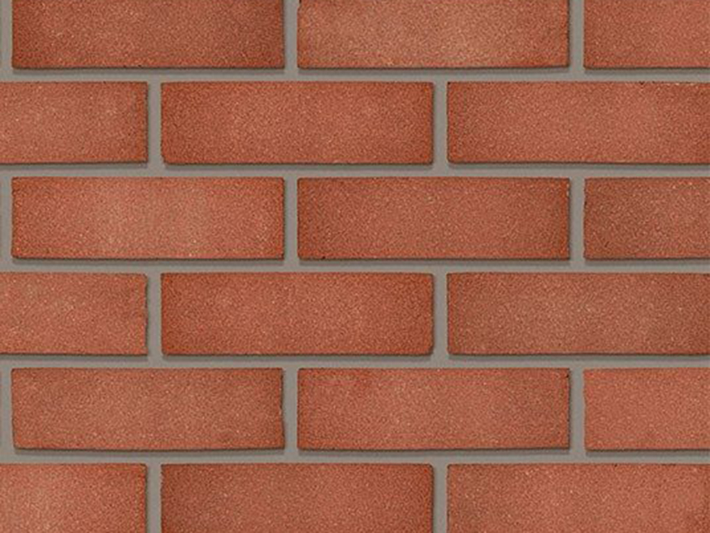 Close up of a wall of Swarland Red Sandfaced bricks