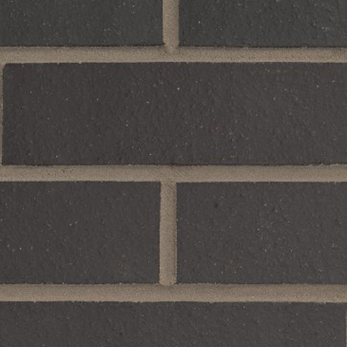 Close up of a wall of Dark Moroccan Smooth bricks