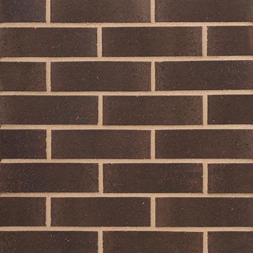 Close up of a wall of Swarland Black 73mm bricks