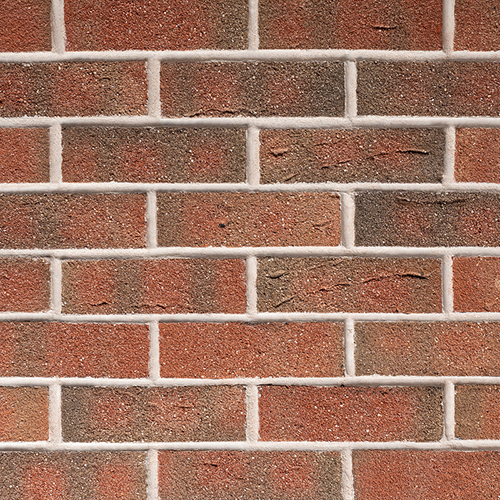 Close up of a wall of New Town Red Multi bricks