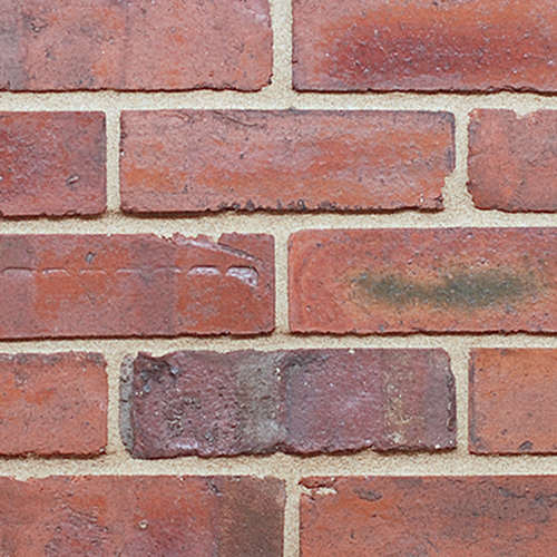 Close up of a wall of Old Terraced Weathered bricks
