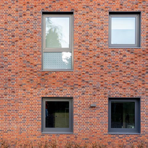 Red Multi Stock bricks around some windows on a house
