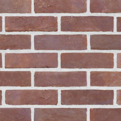 Close up of a wall of Natural Red Multi bricks