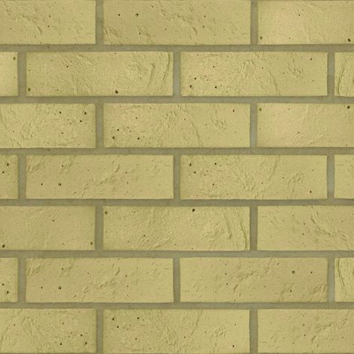 Close up of a wall of Yellow Textured bricks