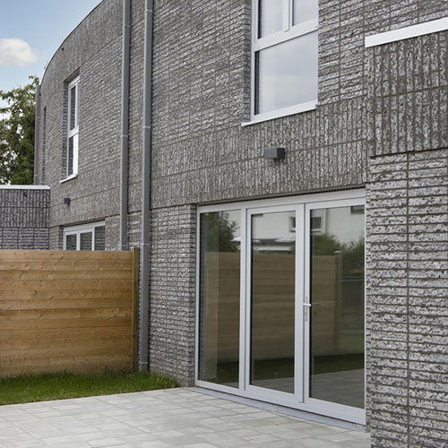 An exterior of a house built using Atlantis One bricks