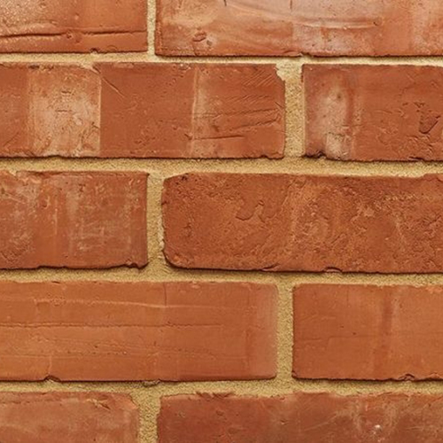 Close up of a wall of Victorian Orange Wirecut bricks