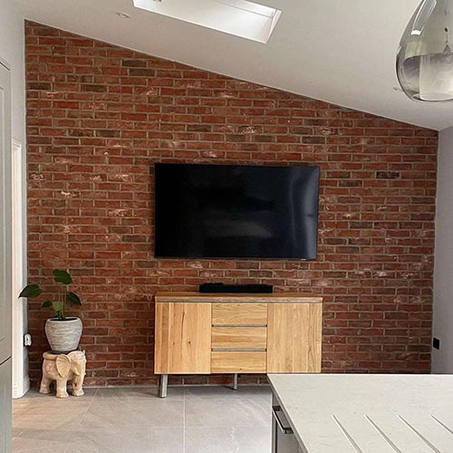 An Athena Blend brick slip wall in a living room