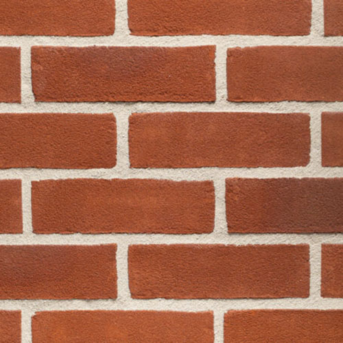 Close up of a wall of Anglian Red Stock bricks