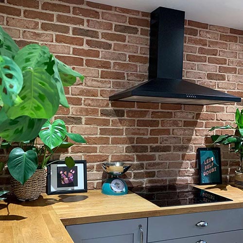 A Whitby Red Multi brick slip kitchen splashback