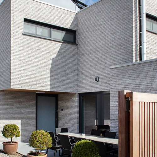 An exterior of a house built using Atlantis Three bricks