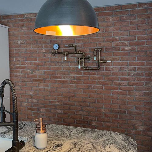 An Athena Blend brick slip wall in a dining room