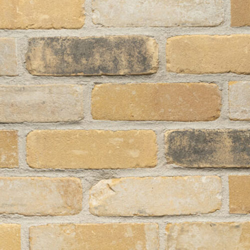 Close up of a wall of Newnham Yellow Antique bricks