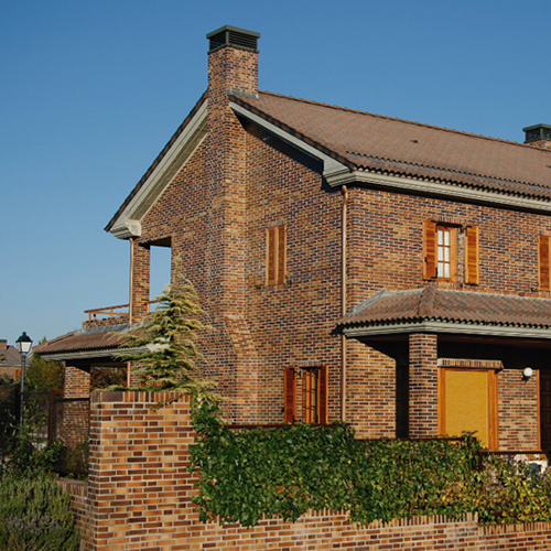 An exterior of a house built using Yellow Multi Smooth bricks