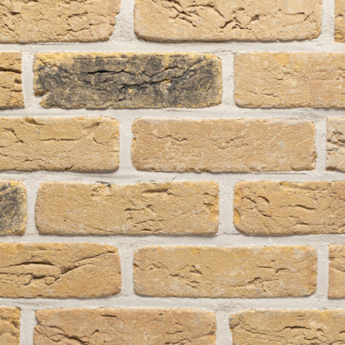 Close up of a wall of Cottingham Weathered Cream bricks