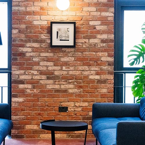A Whitby Red Multi brick slip feature wall