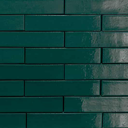 Close up of a wall of Green Glazed bricks