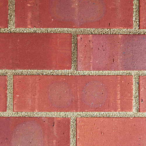Close up of a wall of Multi Red Rustic bricks