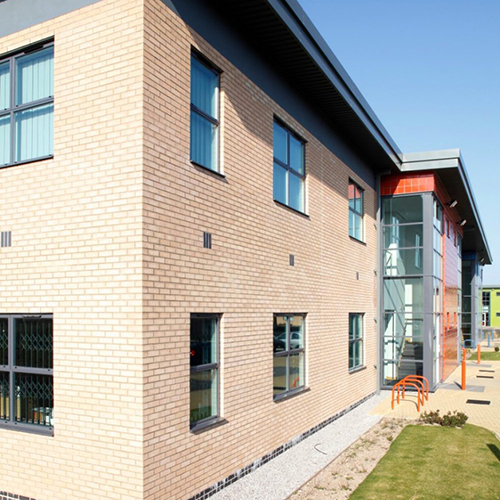 A Sahara Buff brick building