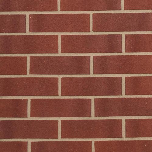 Close up of a wall of Swarland Purple Sandfaced bricks