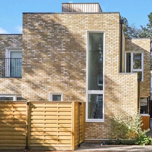 An exterior wall clad in  Retro Mayfair Stock brick slips