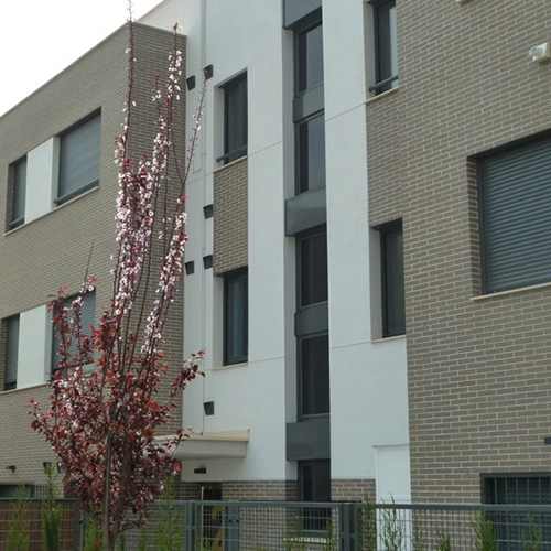 An exterior of a house built using Light Grey Smooth bricks