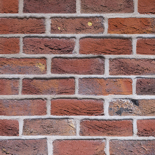 Close up of a wall of Blue Purple Sintered bricks