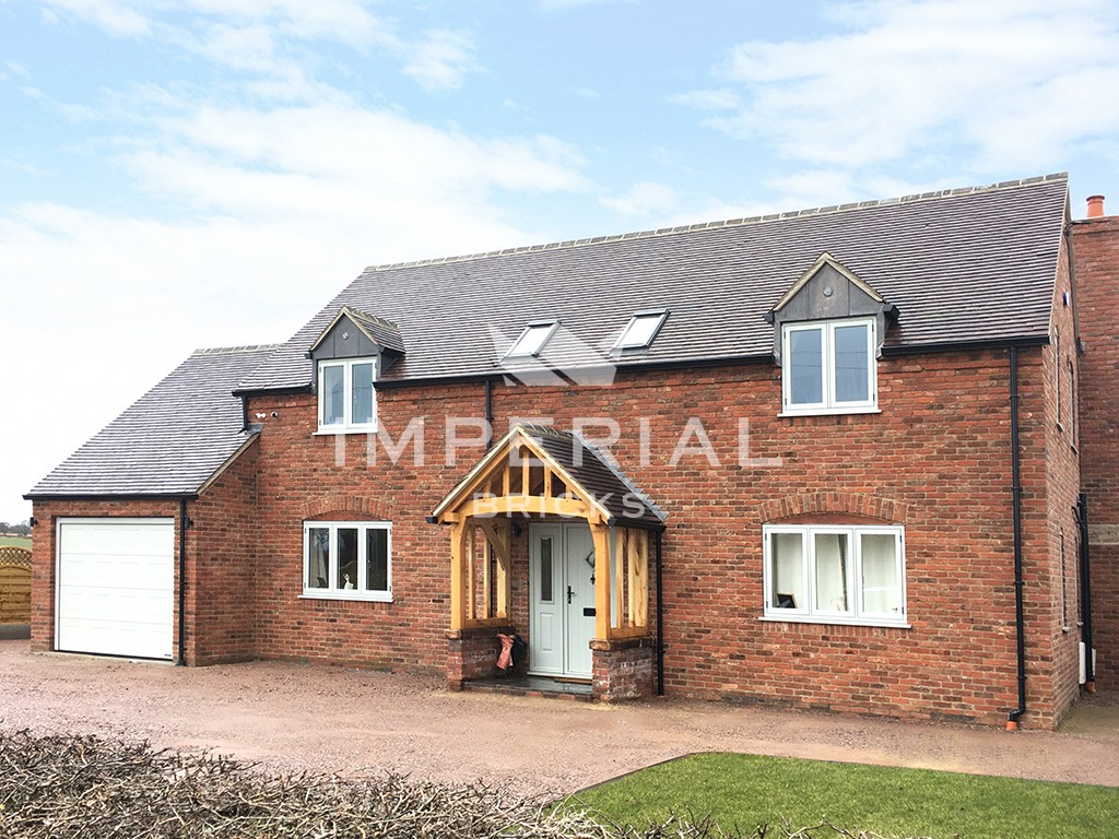 An exterior of a house built using Reclamation Cheshire bricks