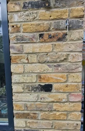 View of a gate post in genuine london yellow stock