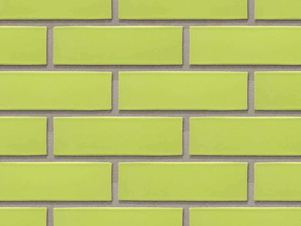 CLose up of a wall of Dublin Light Green Glazed bricks