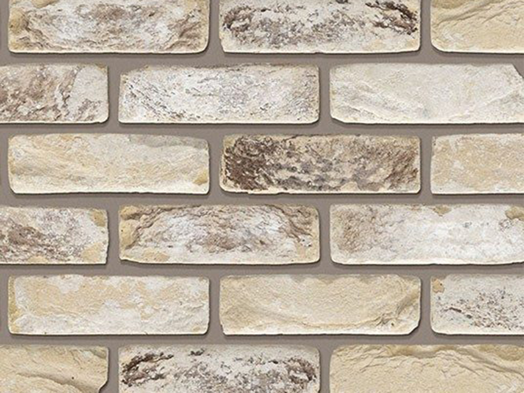 A wall of St Ives Cream Rustica bricks