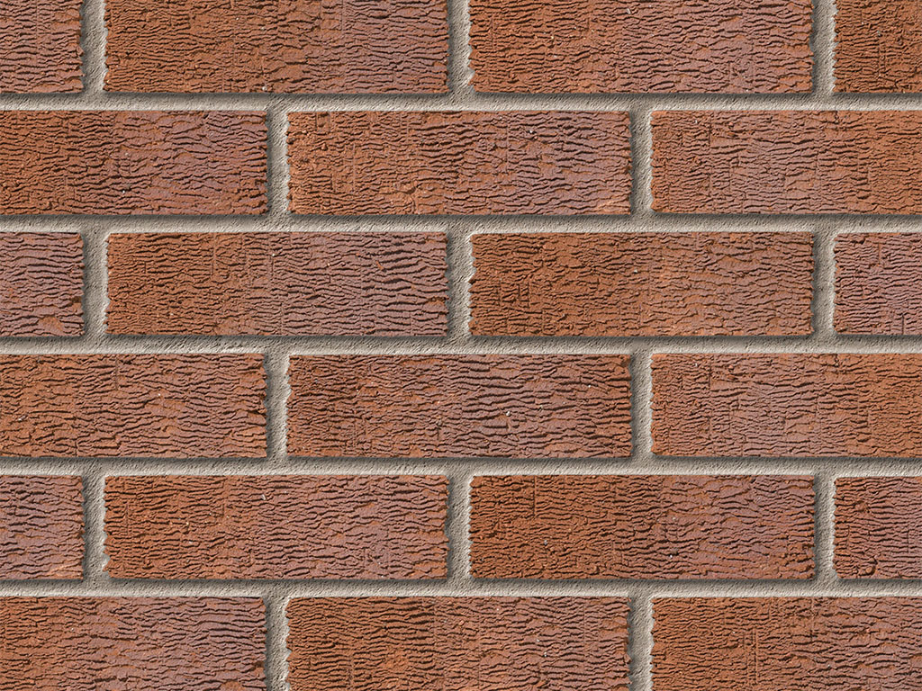 CLose up of a wall of Anglian Red Multi Rustic bricks