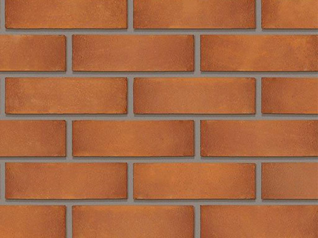 Close up of a wall of Sienna Red bricks