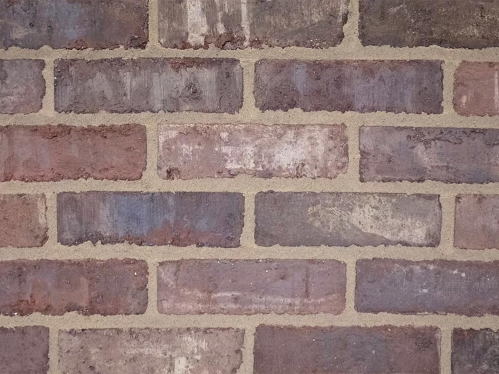 Close up of a wall of Clamp Grey Brown bricks