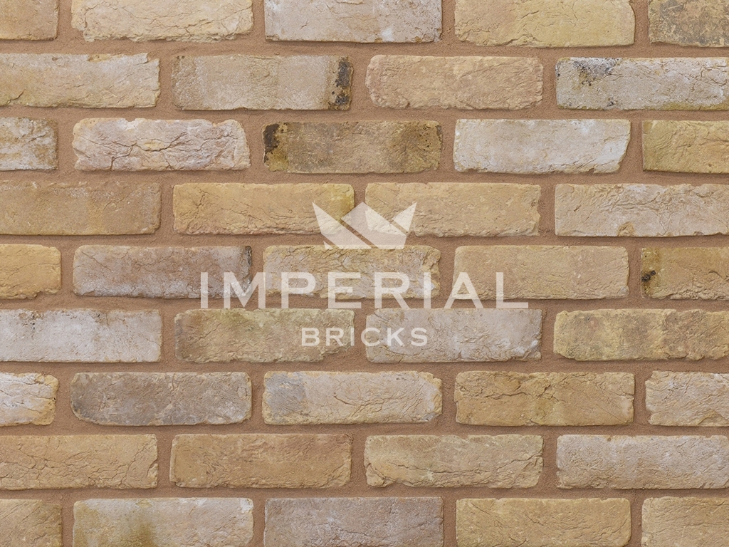 Close up of a wall of Tumbled Reclamation Buff bricks