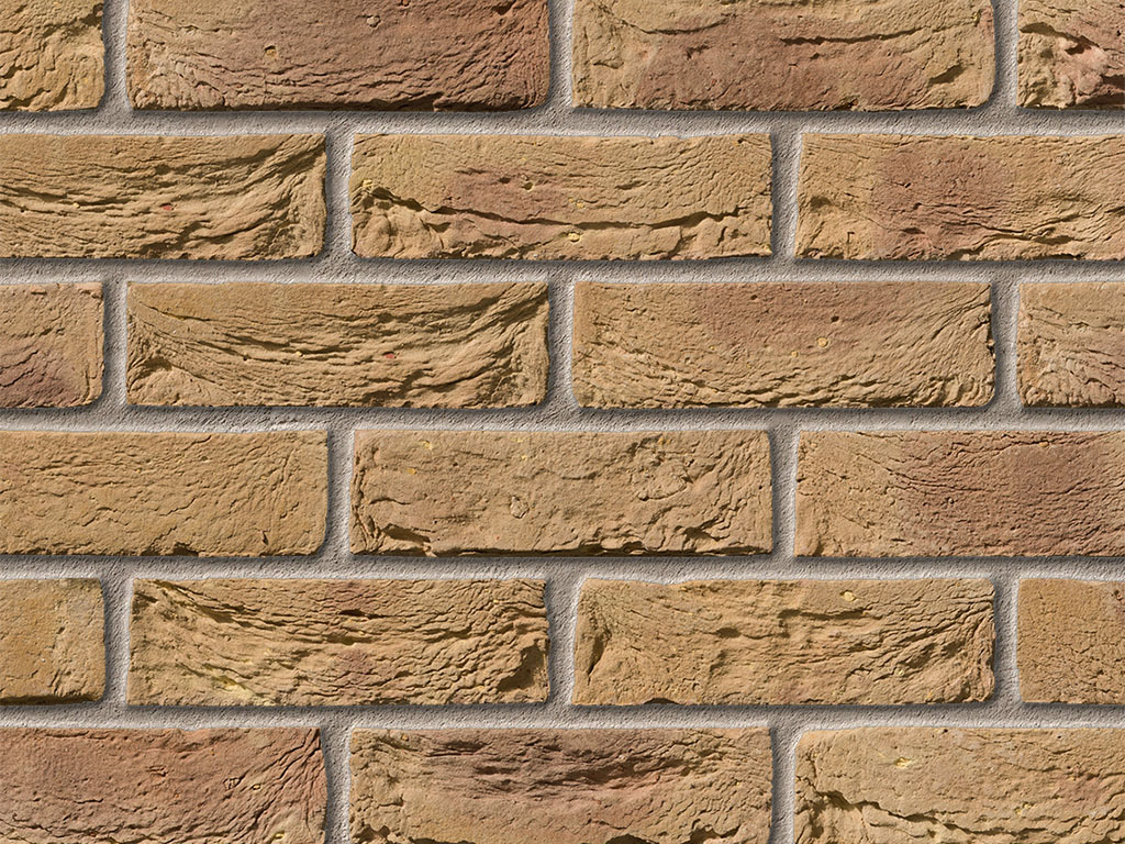 Close up of a wall of Bradgate Golden Purple bricks