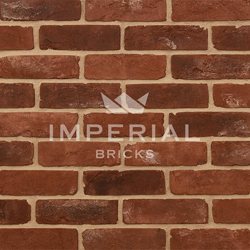 Close up of a wall of Reclamation Red Handmade bricks