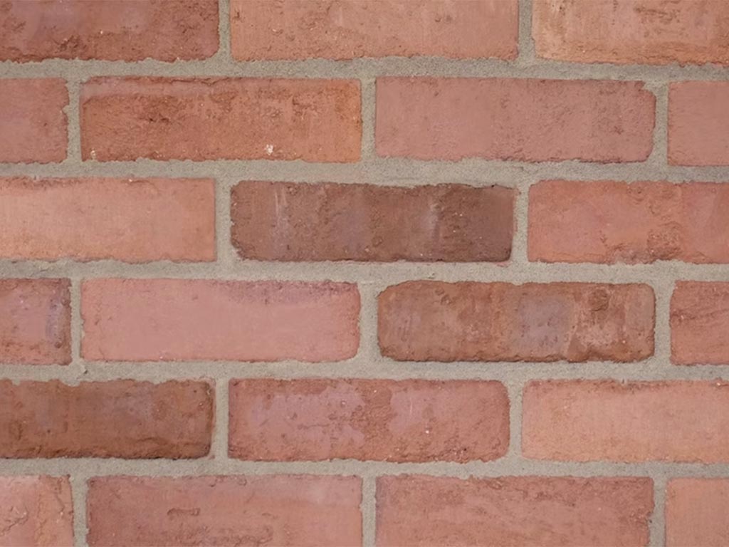 CLose up of a wall of Clamp Natural Orange Medium Light bricks