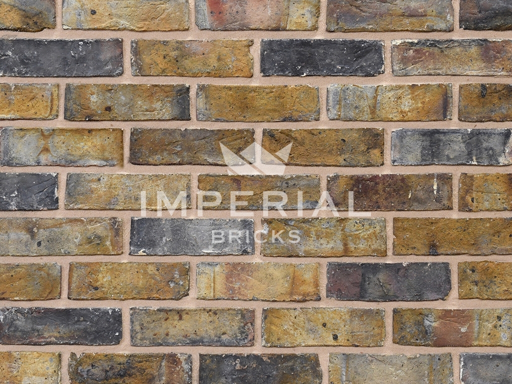Close up of a wall of Dark Weathered Original London Stock bricks