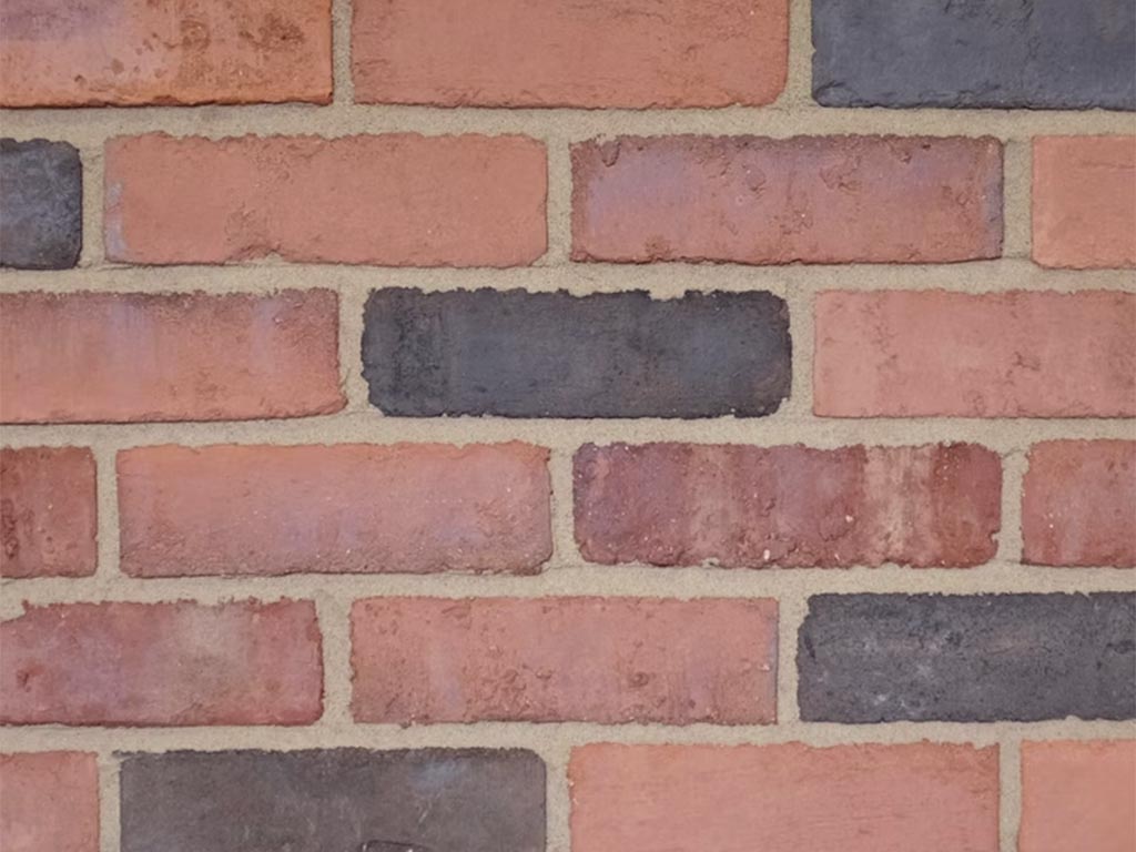 Cose up of a wall of Clamp Antique Orange bricks