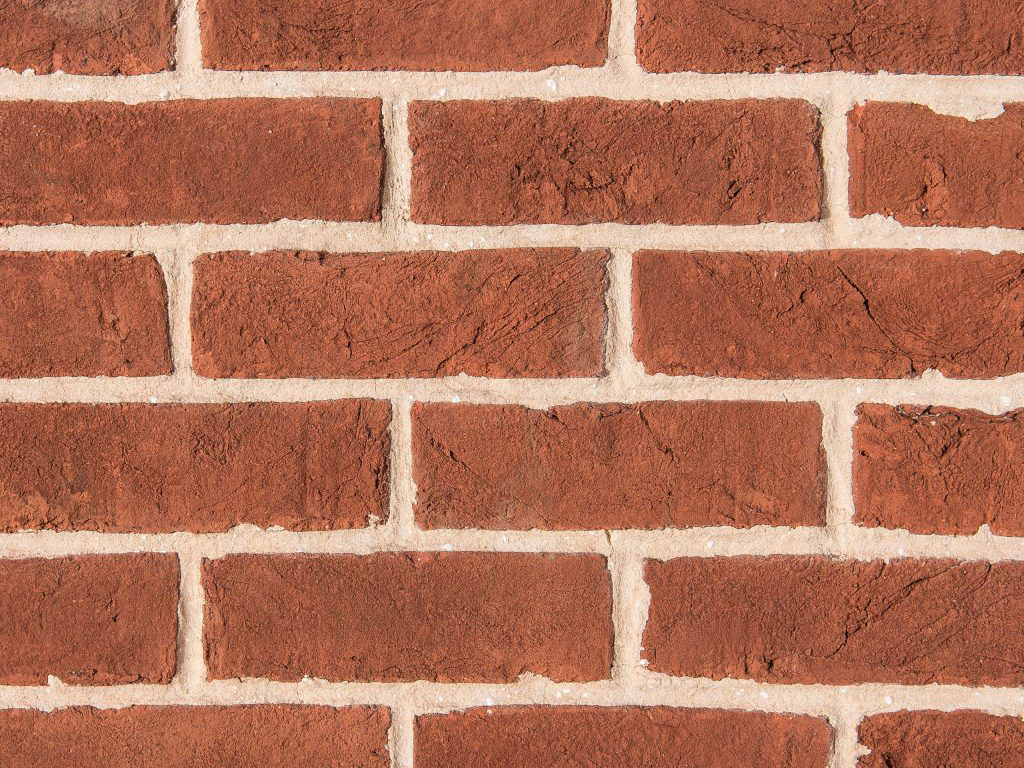 Close up of a wall of Plumley Red Handmade bricks