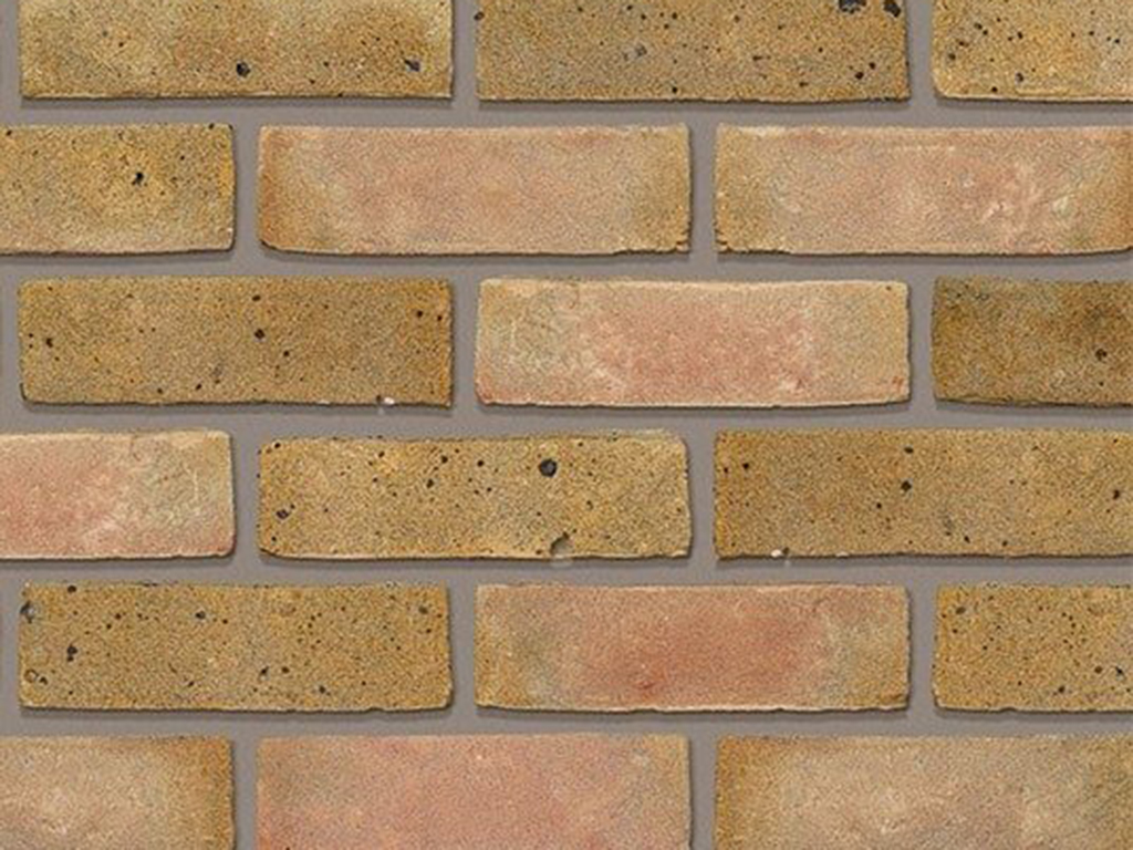 Close up of a wall of Smeed Dean Docklands Yellow Multi bricks