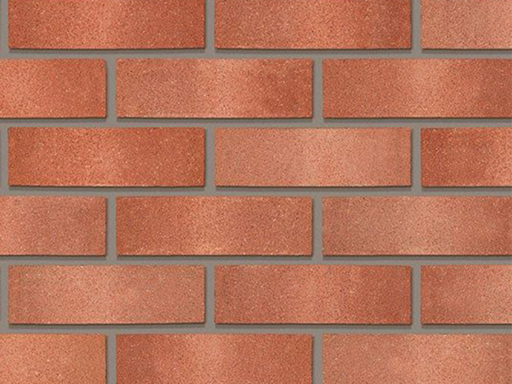 Close up of a wall of Cinnabar Red Multi bricks