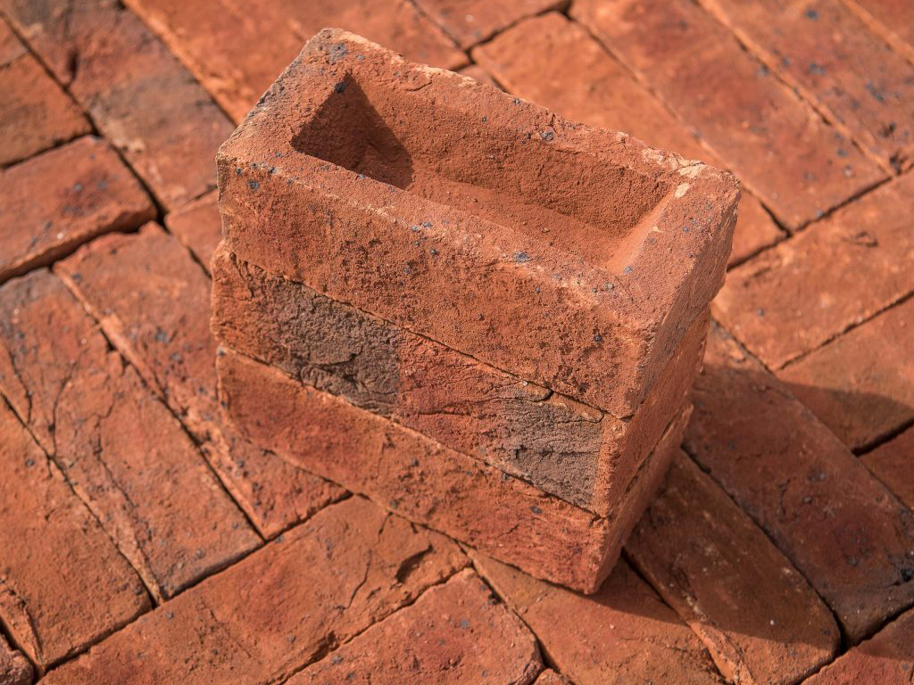 A stack of Dark Multi Handmade