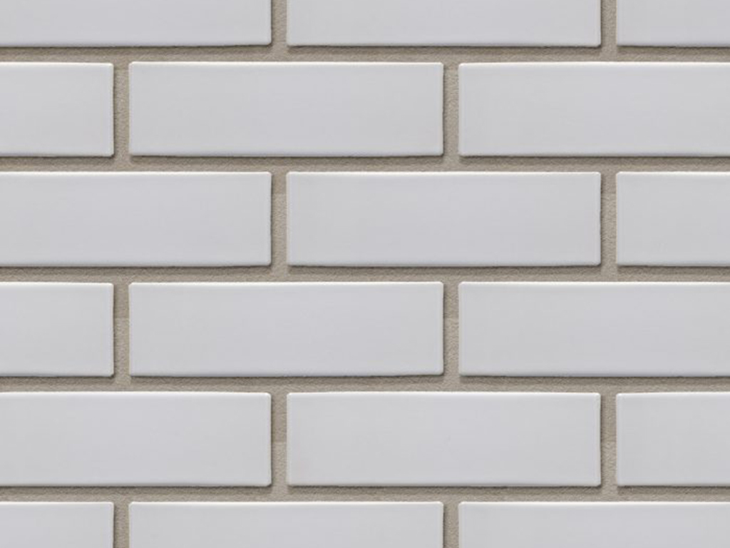 Close up of a wall of Vienna Light Grey Glazed bricks